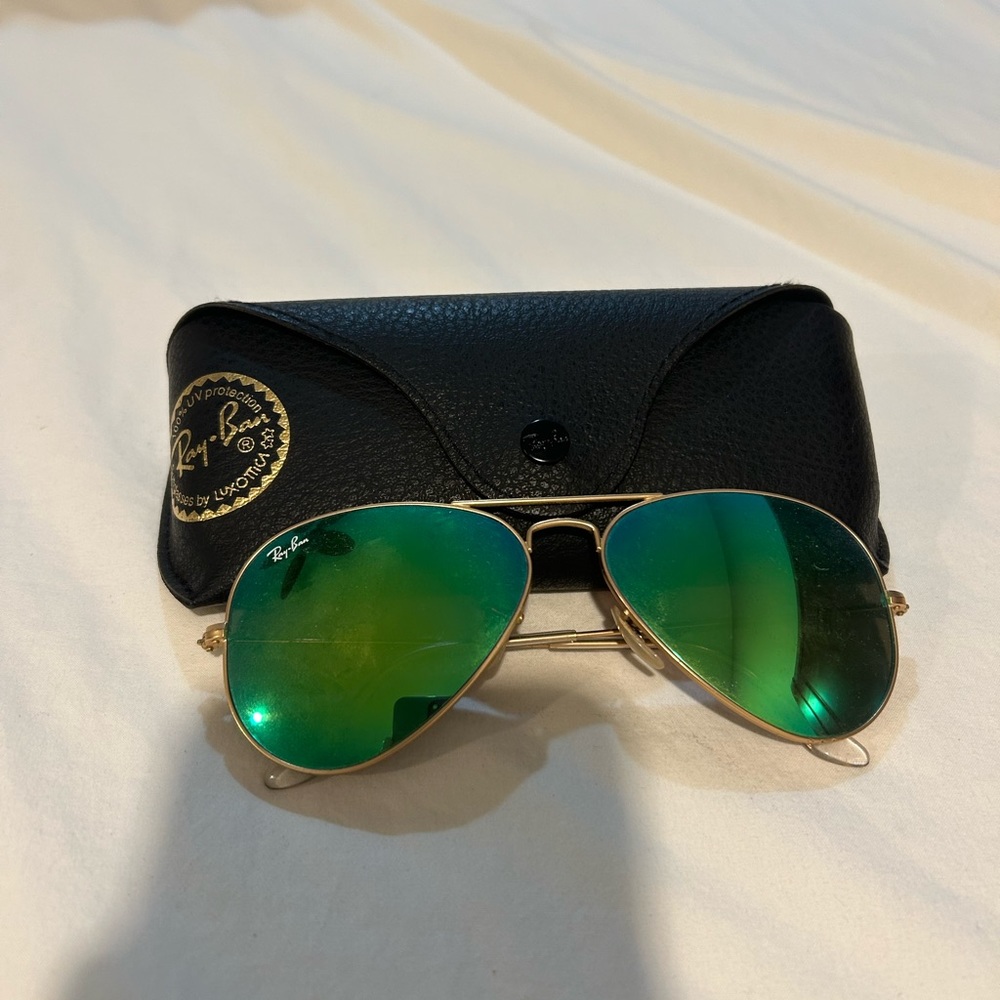 Green reflective raybans. Great condition. Comes with case and cleaner.